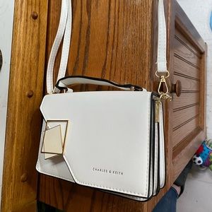 White Charles & Keith cross body purse / bag.